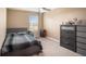 Cozy bedroom featuring a double bed and built-in dresser at 3071 Marine Grass Dr, Wimauma, FL 33598