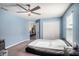 Bedroom with double door closet and ceiling fan at 3071 Marine Grass Dr, Wimauma, FL 33598