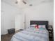 Well-lit bedroom with ceiling fan and a gray headboard at 3071 Marine Grass Dr, Wimauma, FL 33598