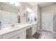 Double vanity bathroom with white cabinets and quartz countertops at 31703 Cabana Rye Ave, San Antonio, FL 33576