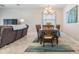 Dining area with wooden table, chandelier, and rug at 31703 Cabana Rye Ave, San Antonio, FL 33576