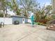 Spacious backyard with a patio, detached garage and seating area at 320 N Madison Ave, Clearwater, FL 33755