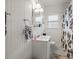 Simple bathroom with white subway tiles and black and white floor at 320 N Madison Ave, Clearwater, FL 33755