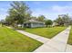 Side view of the house showing the landscaping and street at 320 N Madison Ave, Clearwater, FL 33755