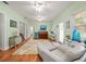 Bright living room with hardwood floors and a light green wall at 320 N Madison Ave, Clearwater, FL 33755