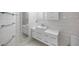 Clean bathroom with subway tile and floating vanity at 331 Cleveland St # 1102, Clearwater, FL 33755