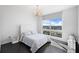 Bright bedroom with city view and elegant chandelier at 331 Cleveland St # 1102, Clearwater, FL 33755