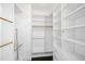 Spacious closet with built-in shelving and hanging rods at 331 Cleveland St # 1102, Clearwater, FL 33755