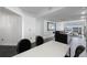 Modern dining area with white table and black chairs at 331 Cleveland St # 1102, Clearwater, FL 33755