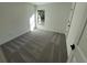 Bright bedroom with carpeted floor and a window at 3355 Moncrief Ave, North Port, FL 34286