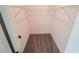 Walk-in closet with wire shelving and carpeted floor at 3355 Moncrief Ave, North Port, FL 34286