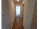 Hallway with tile floors and access to bedrooms and closets at 3355 Moncrief Ave, North Port, FL 34286