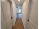 Clean hallway with light walls and tile flooring at 3355 Moncrief Ave, North Port, FL 34286