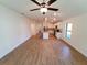 Open living room with kitchen view and tile floor at 3355 Moncrief Ave, North Port, FL 34286