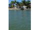 Aerial view of waterfront home with palm trees at 341 E Madeira Ave, Madeira Beach, FL 33708