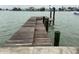 Long wooden dock stretching over calm waters at 341 E Madeira Ave, Madeira Beach, FL 33708