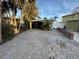 Home with carport and brick driveway at 341 E Madeira Ave, Madeira Beach, FL 33708