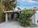 Home with covered carport and landscaping at 341 E Madeira Ave, Madeira Beach, FL 33708