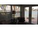 Bright living room with water views and French doors at 341 E Madeira Ave, Madeira Beach, FL 33708