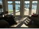 Living room with water views and French doors; pet friendly at 341 E Madeira Ave, Madeira Beach, FL 33708