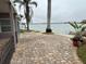 Brick-paved patio area overlooking the calm waters of the marina at 341 E Madeira Ave, Madeira Beach, FL 33708