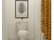 Small bathroom with toilet, shower, and framed art print at 35254 Gravelly Dr, Zephyrhills, FL 33541