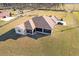 Aerial view of house and large backyard with screened porch at 36511 Frazee Hill Rd, Dade City, FL 33523