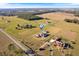 Aerial view of a home on a large lot with other houses and land in view at 36511 Frazee Hill Rd, Dade City, FL 33523