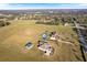 Aerial view of a home on a large lot with other houses and land in view at 36511 Frazee Hill Rd, Dade City, FL 33523