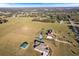 Aerial view of a home on a large lot with other houses and land in view at 36511 Frazee Hill Rd, Dade City, FL 33523