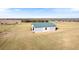 Detached garage with green metal roof, in a rural setting at 36511 Frazee Hill Rd, Dade City, FL 33523