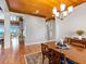 Bright dining room featuring hardwood floors and a view to the living room at 36511 Frazee Hill Rd, Dade City, FL 33523