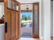 Open door revealing a view of the front porch and yard at 36511 Frazee Hill Rd, Dade City, FL 33523