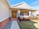 Front entrance with wooden door and landscaped walkway at 36511 Frazee Hill Rd, Dade City, FL 33523