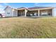 House with screened porch and grassy backyard at 36511 Frazee Hill Rd, Dade City, FL 33523