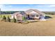 Brick and siding house with landscaping and a two-car garage at 36511 Frazee Hill Rd, Dade City, FL 33523