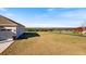 House exterior with garage and expansive view of the landscape at 36511 Frazee Hill Rd, Dade City, FL 33523