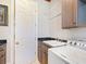 Laundry room with utility sink and cabinets at 36511 Frazee Hill Rd, Dade City, FL 33523