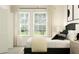 Bedroom with a queen bed, neutral color scheme, and large windows at 3740 Capital Reserve Dr, Plant City, FL 33565