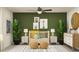 Bedroom with a crib, neutral color scheme, and safari-themed decor at 3740 Capital Reserve Dr, Plant City, FL 33565