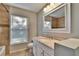 Clean bathroom with granite countertop, updated vanity and large mirror at 4101 Concord Way, Plant City, FL 33566