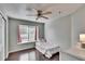 Bedroom with ceiling fan, window seat, and wood-look flooring at 4101 Concord Way, Plant City, FL 33566