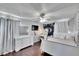 Bedroom with dresser, ceiling fan, and large bed at 4101 Concord Way, Plant City, FL 33566