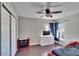 Bedroom with ceiling fan, double door closet, and TV stand at 4101 Concord Way, Plant City, FL 33566