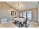 Charming dining area with three windows, a chandelier and a patterned rug at 4101 Concord Way, Plant City, FL 33566