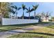 Home exterior view with white fence and palm trees at 4101 Concord Way, Plant City, FL 33566