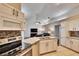 Updated kitchen with granite countertops, stainless steel appliances, and breakfast bar at 4101 Concord Way, Plant City, FL 33566