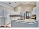 Modern kitchen with white cabinets, granite countertops, and stainless steel appliances at 4101 Concord Way, Plant City, FL 33566