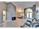 Spacious living room with a leather couch, offering views of the dining area and foyer at 4101 Concord Way, Plant City, FL 33566