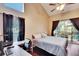 Main bedroom with work space, pool view, and large bed at 4101 Concord Way, Plant City, FL 33566